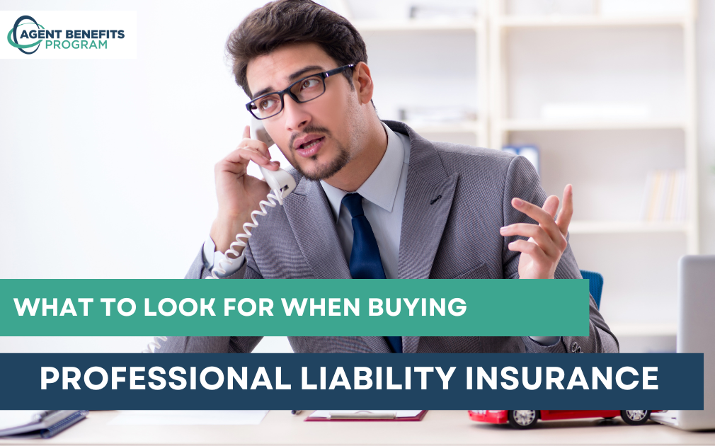 Insurance agent comparing professional liability insurance policy options